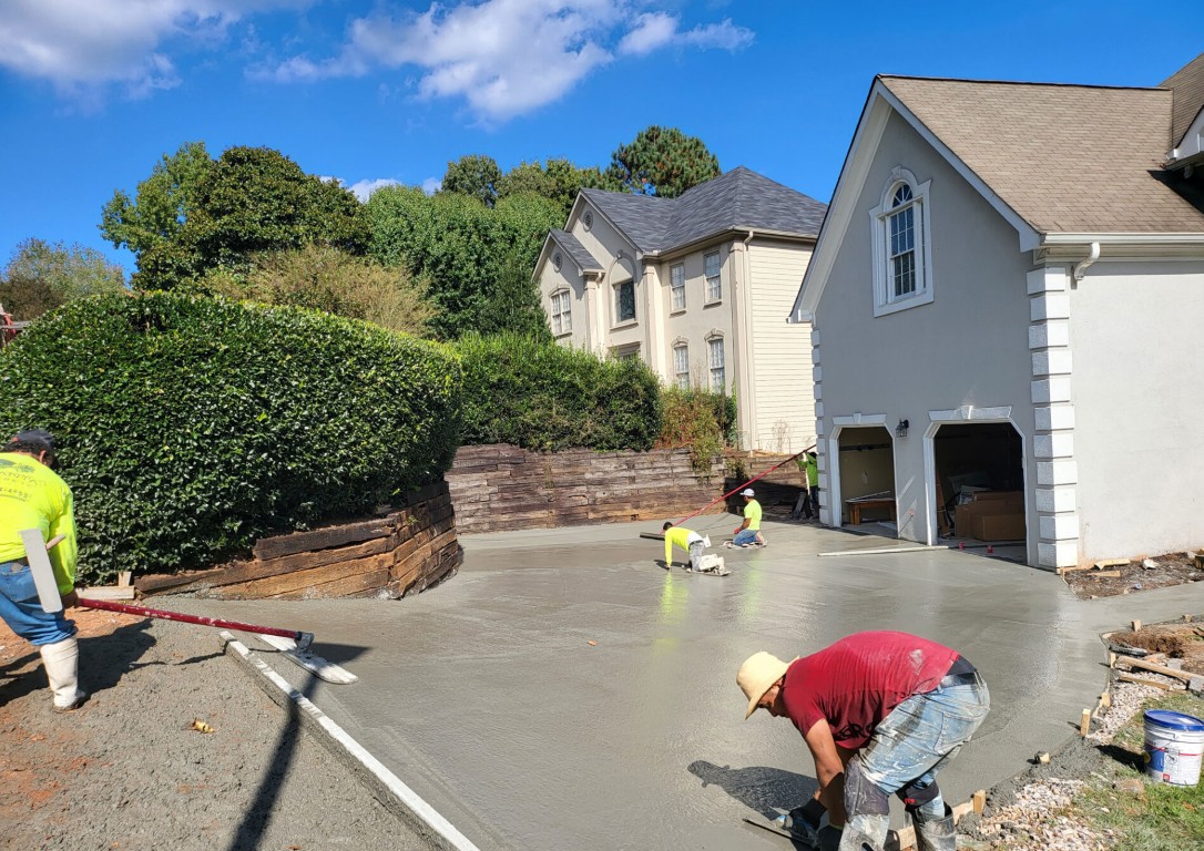 Concrete contractor team working on driveway in Wheaton, MD